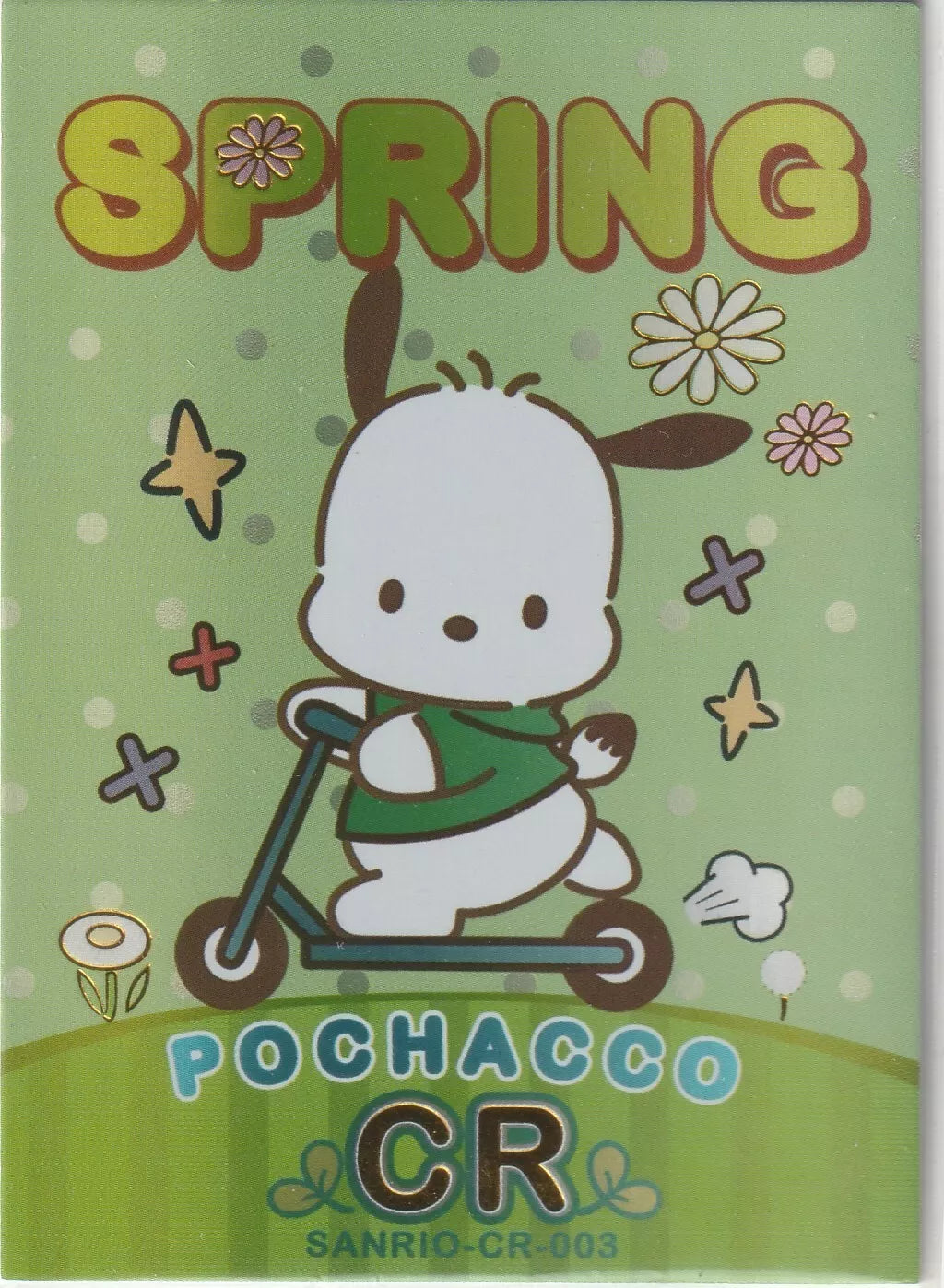 Pochacco from Sanrio riding a scooter in a spring-themed design with flowers and stars, decorated with a foil finish.