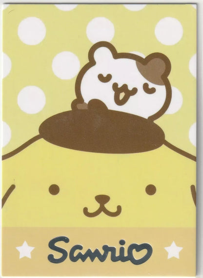 Sanrio-LPR-005 Hello Kitty Phone Charm Crystal Card Back - Close-up of Pompompurin with a polka-dot yellow background and Sanrio logo