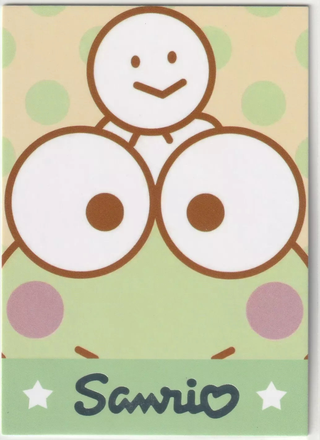 Sanrio-SPR-003 Pochacco Traditional Costume Card Back - Close-up of Keroppi's face with a snowman on his head and a polka dot background.