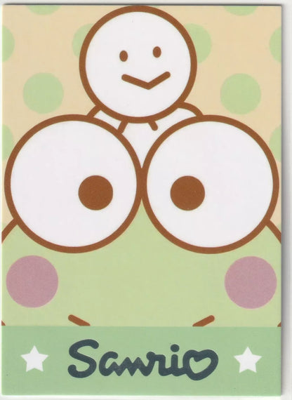 Sanrio-SPR-003 Pochacco Traditional Costume Card Back - Close-up of Keroppi's face with a snowman on his head and a polka dot background.