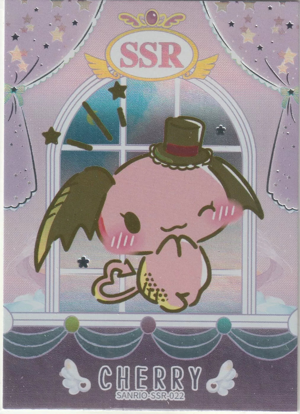 A foil character card showing Cherry, a dragon-winged Sanrio character, wearing a top hat and holding a heart-shaped hand gesture.

