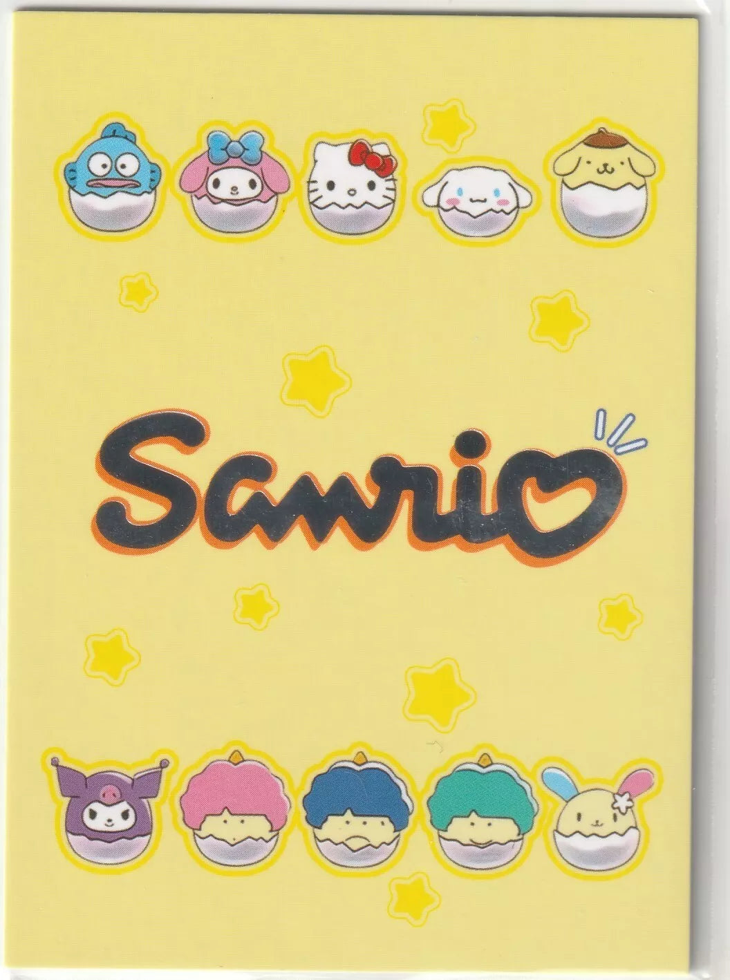 "Sanrio collectible card back with a beige background, metallic polka dots, and a golden crown sketch with surrounding hearts and stars, featuring the card number Sanrio-TR-001."