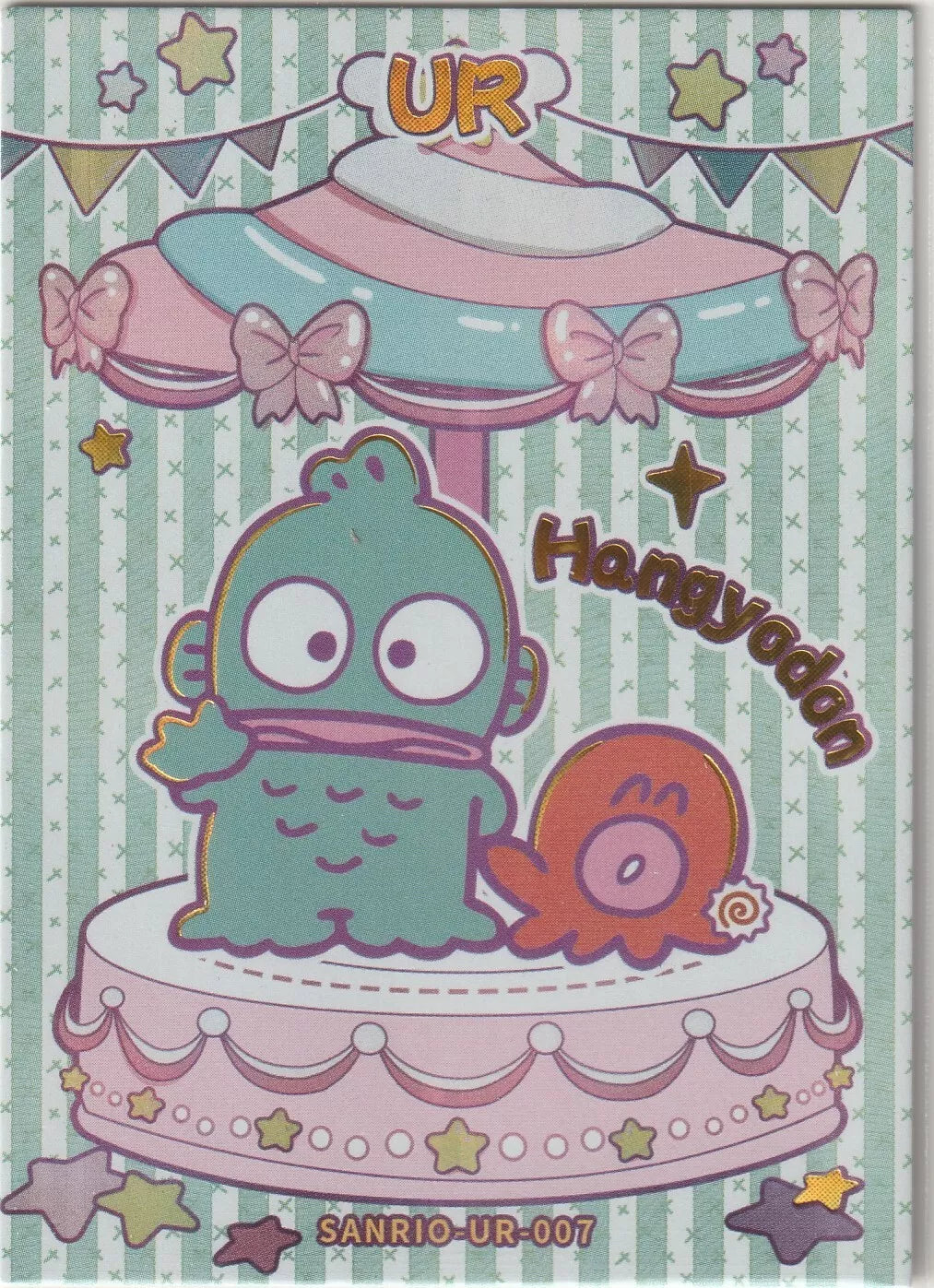 Hangyodon Ultra Rare (UR) Sanrio collectible card front, featuring Hangyodon and his octopus companion on a carousel with pastel bows, stars, and bunting in a foil finish.