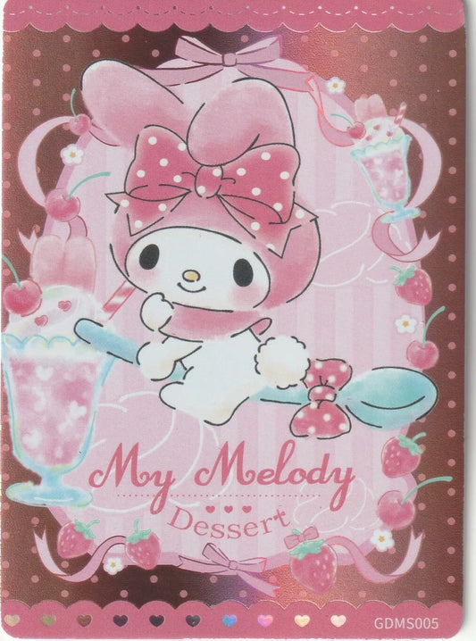 My Melody happily holding a large spoon, surrounded by strawberries and cherries in a dessert-themed pink and chocolate-colored card design.