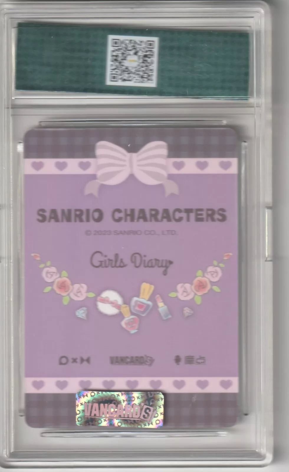 Sanrio Characters Girls Diary card back with pink and lavender colors, featuring a pink bow, hearts, roses, and beauty items, along with the Vancards' logo at the bottom in protective casing
