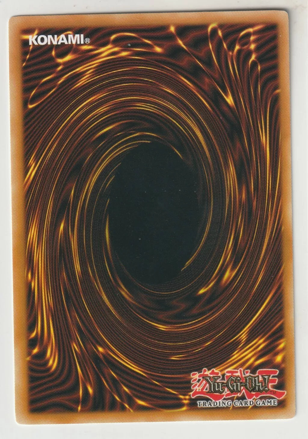 "Yu-Gi-Oh! card back in near-mint condition with the iconic swirl design."