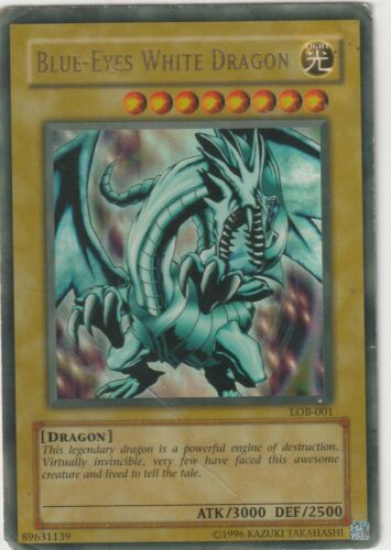 "Yu-Gi-Oh! card showing the legendary Blue-Eyes White Dragon, a fierce dragon with blue scales, set against a misty background."