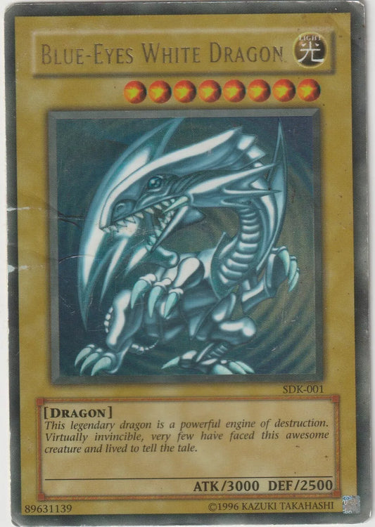 "Yu-Gi-Oh! card featuring the legendary Blue-Eyes White Dragon, depicted with white scales and blue eyes in a dynamic attack pose."