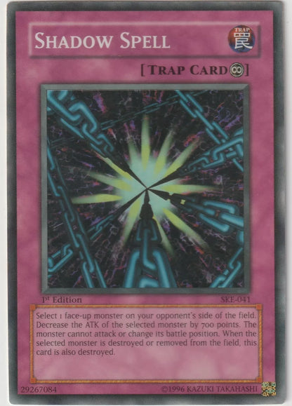  "Yu-Gi-Oh! card artwork depicting the trap card 'Shadow Spell,' featuring mystical chains and a dark energy vortex."