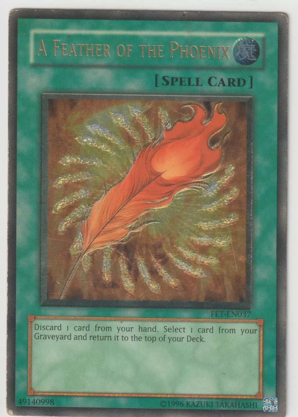  Ultra Rare 1st Edition Yu-Gi-Oh! A Feather of the Phoenix spell card from 2004 Flaming Eternity FET-EN037 set, featuring a detailed fiery phoenix feather design.