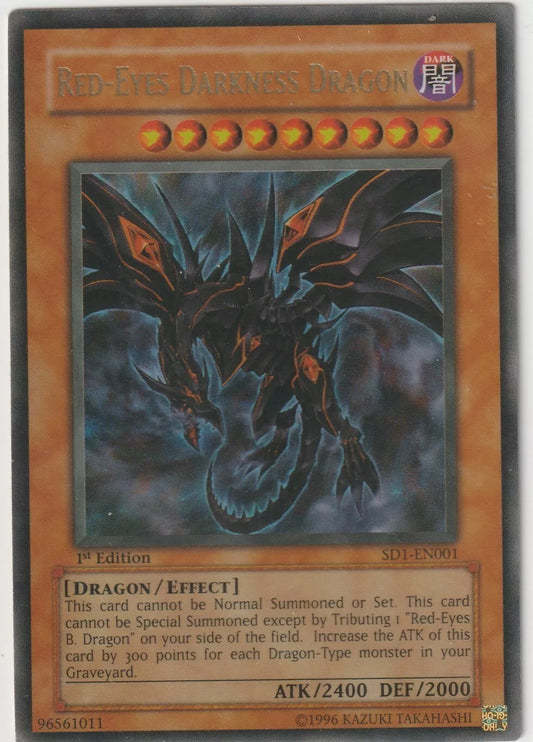 Red-Eyes Darkness Dragon card showing the black dragon with orange glowing highlights in a stormy background from the 2005 Dragon's Roar structure deck.